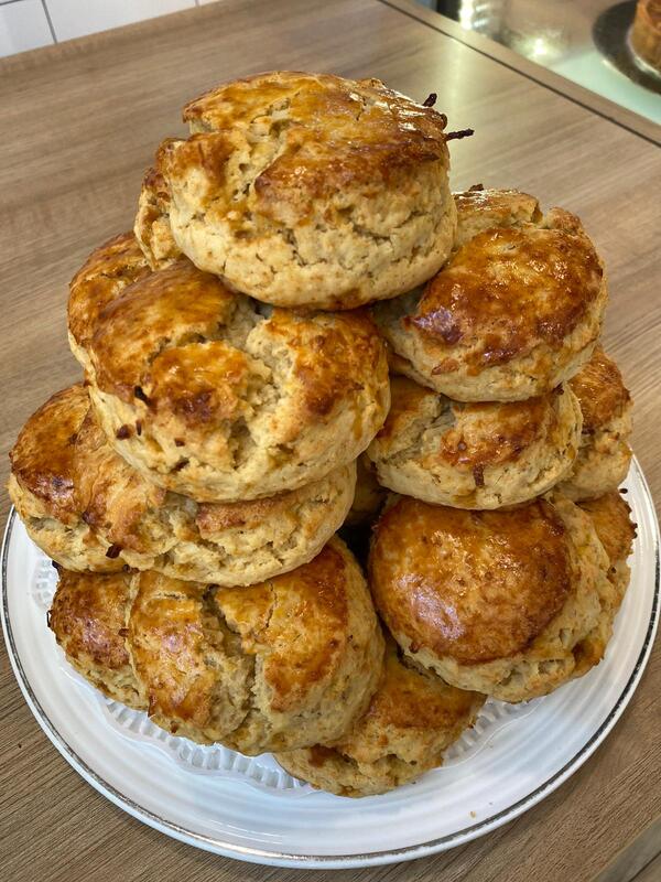 A plate full with Coconut Walnut Scones lined with a dolly paper