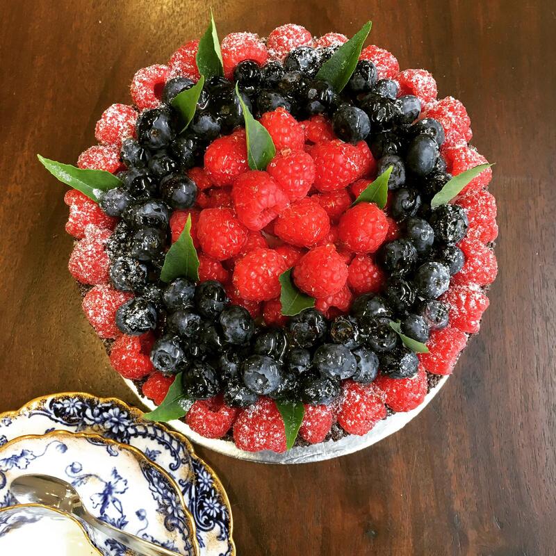 Simple Chocolate Cake topped with mixed berries (subject to change) 