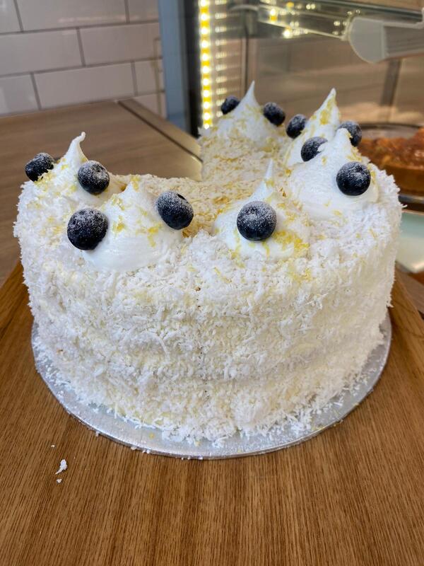Vanilla Bergamot with Blueberry flan topped with white shredded snowy coconut